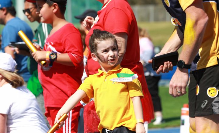 Students and adults prepare for the relay race at Sports Carnival 2018